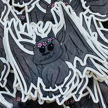 Load image into Gallery viewer, Stack of bat like stone gargoyle stickers. He has a flower crown on his head.