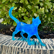 Load image into Gallery viewer, Blue cat figurine on a stone surface with green foliage in the background
